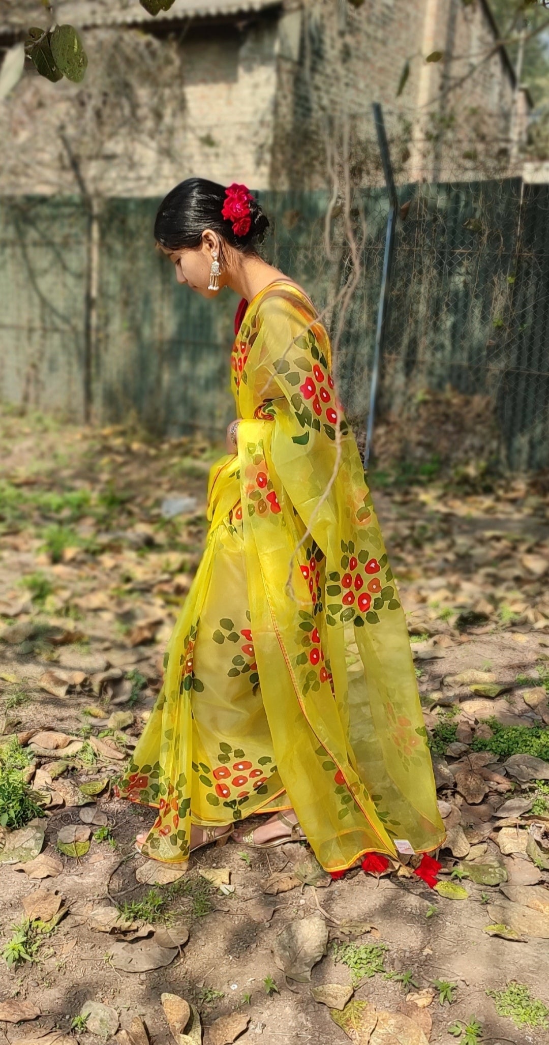 Yellow Hand-painted  organza saree with  beautiful Red tassels