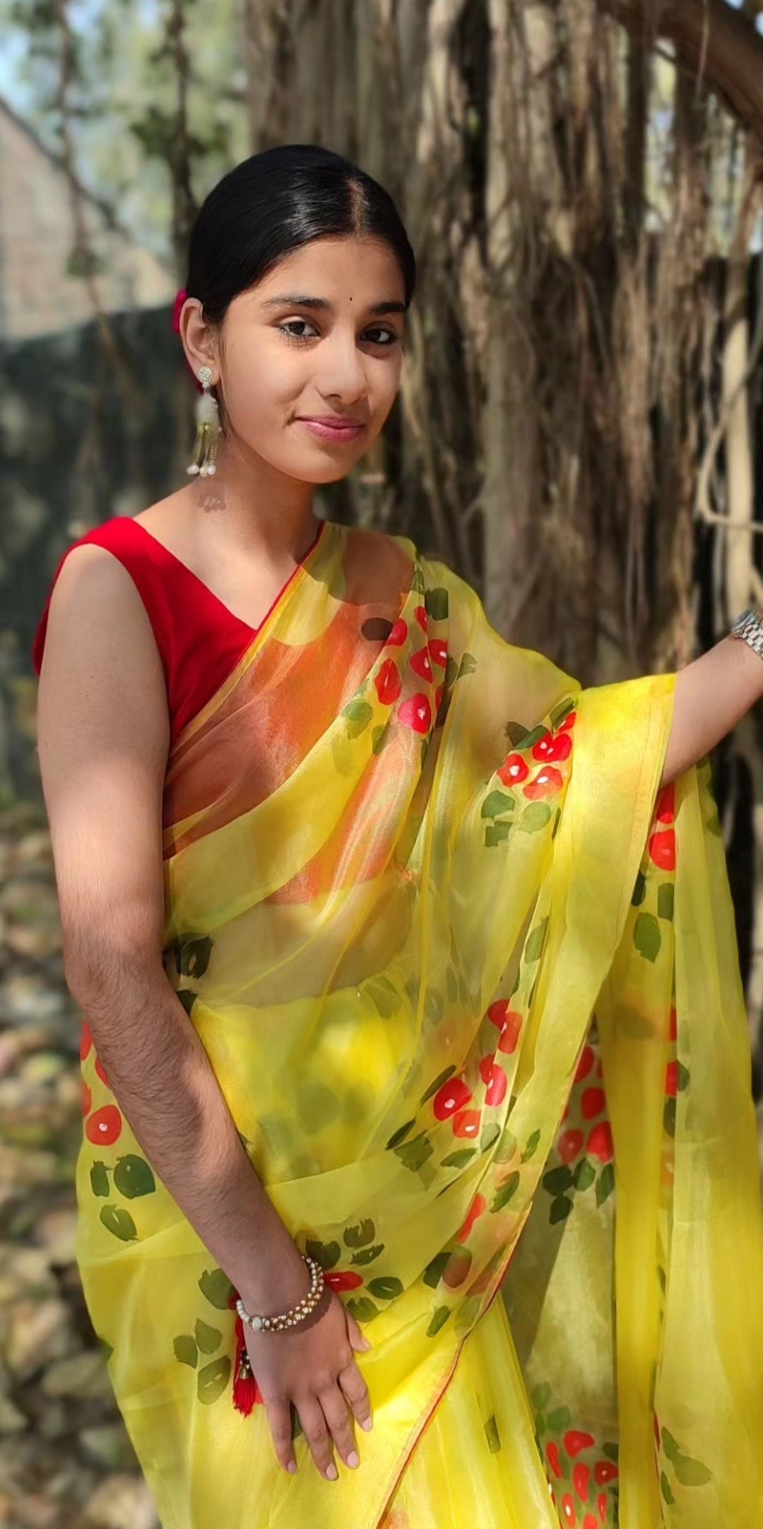 Yellow Hand-painted  organza saree with  beautiful Red tassels