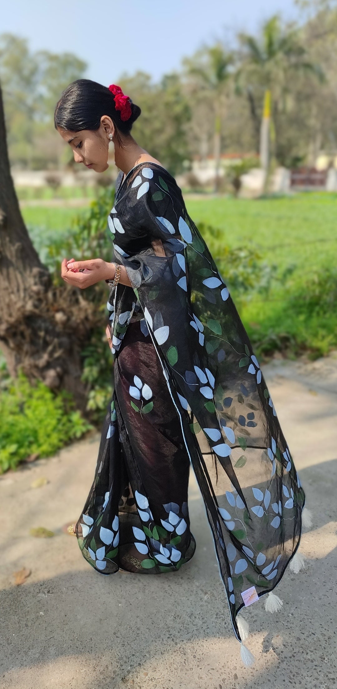 Hand-painted bougainvillea organza saree with white tassel
