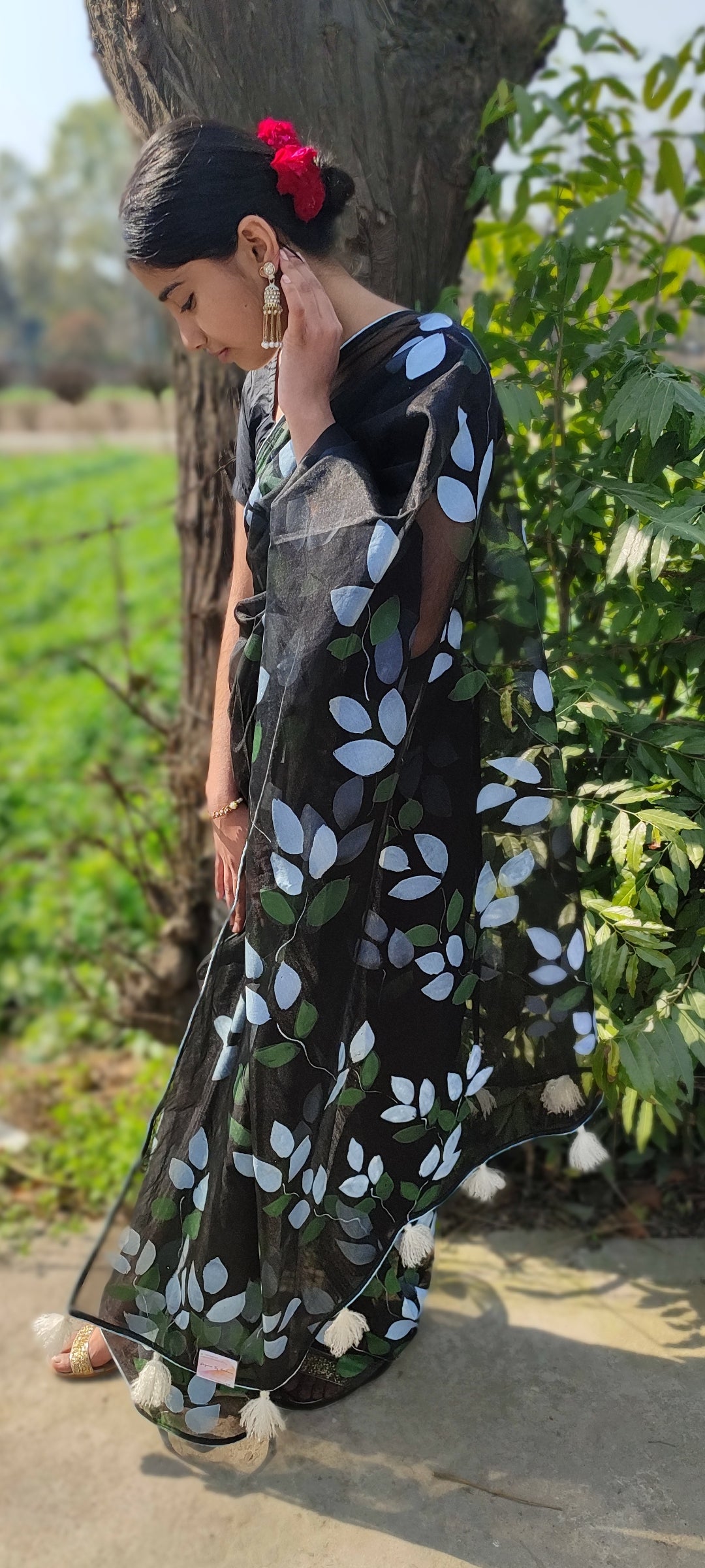Hand-painted bougainvillea organza saree with white tassel
