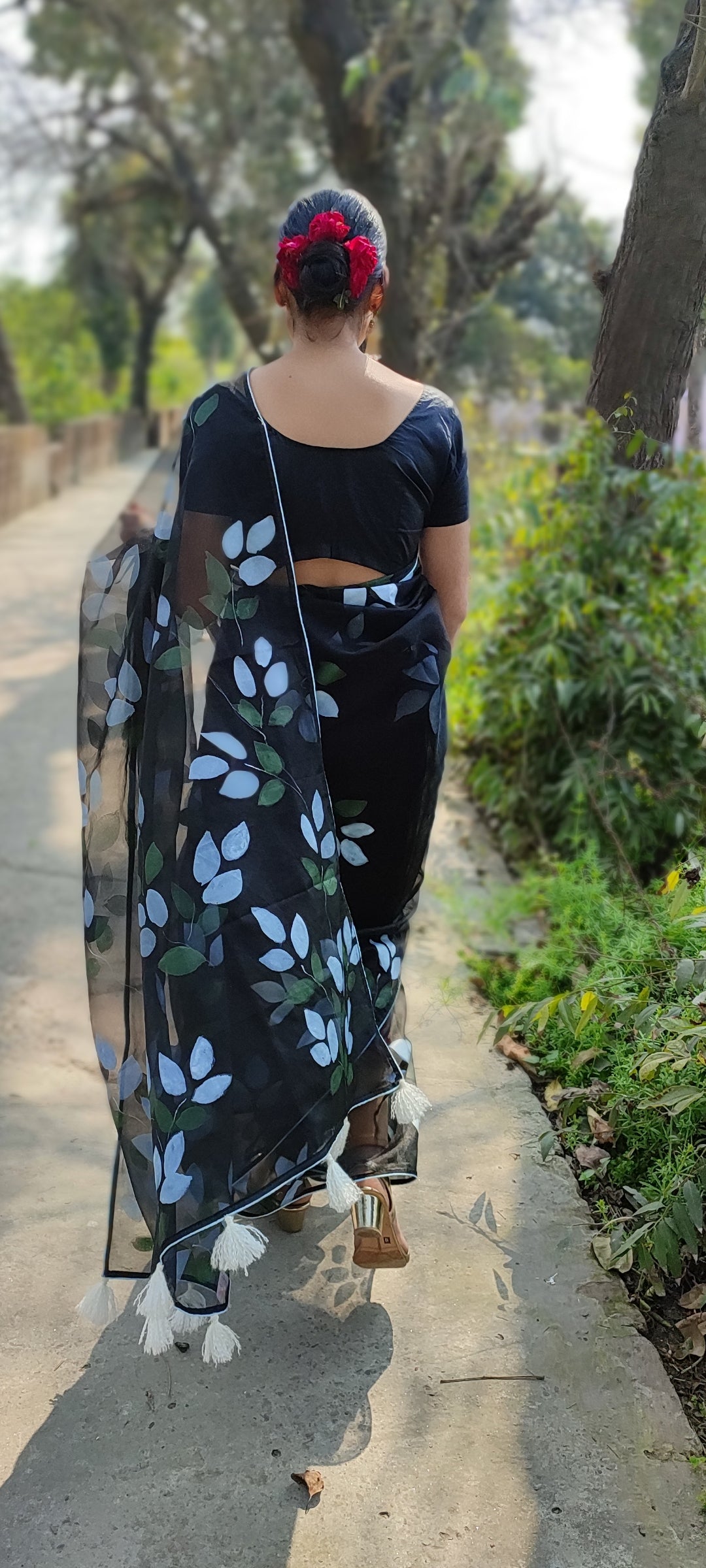 Hand-painted bougainvillea organza saree with white tassel