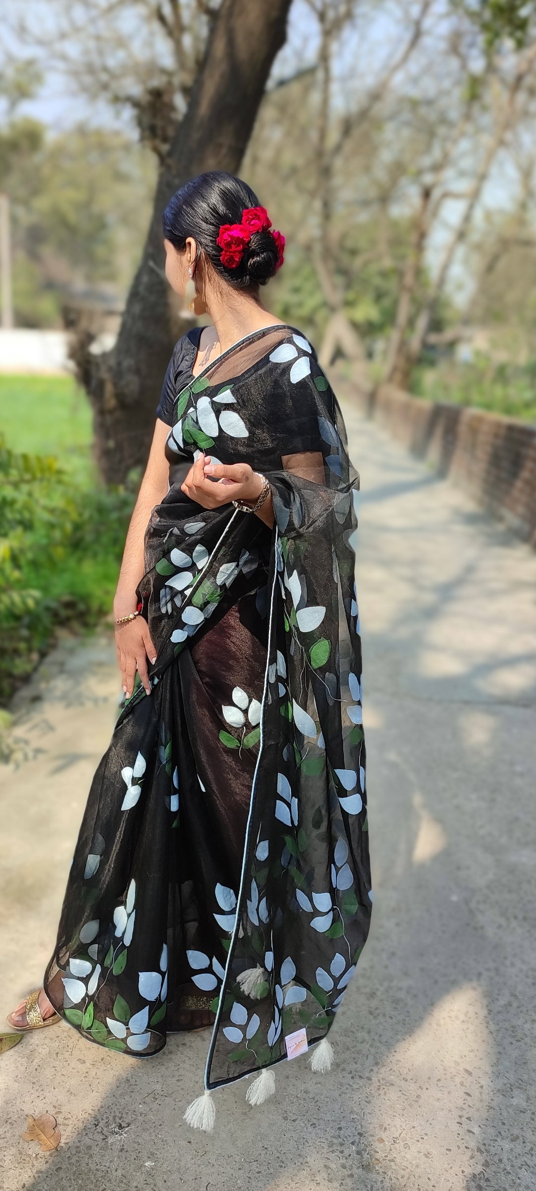 Hand-painted bougainvillea organza saree with white tassel
