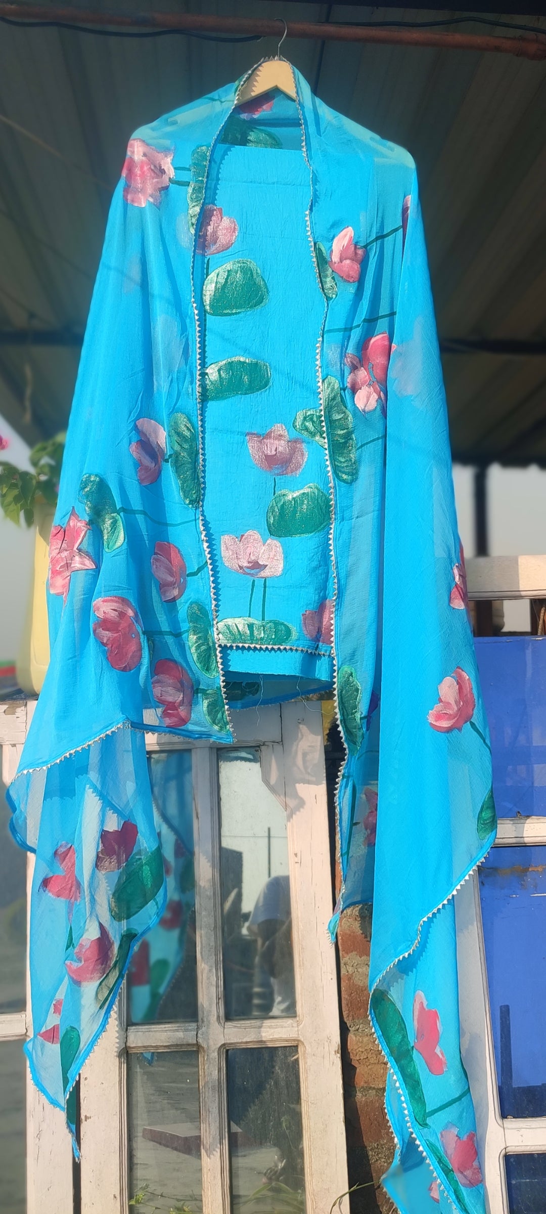 Hand painted lotus  on skyblue suit with pure chiffon dupatta