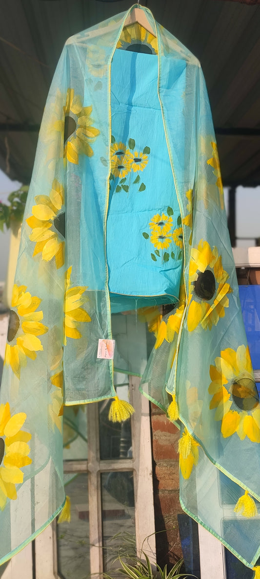 Hand painted  sky blue suit with beautiful sunflowers and organza dupatta.