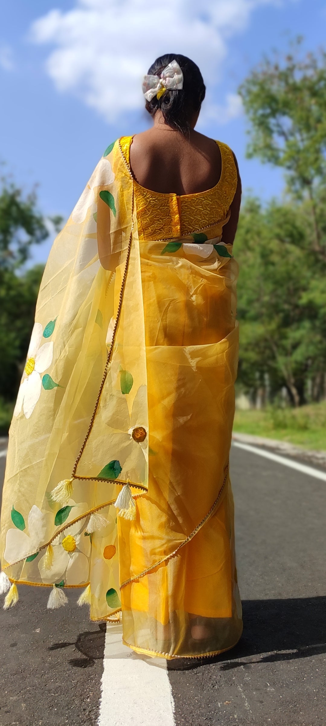 Yellow Handpainted organza  saree with white tassels