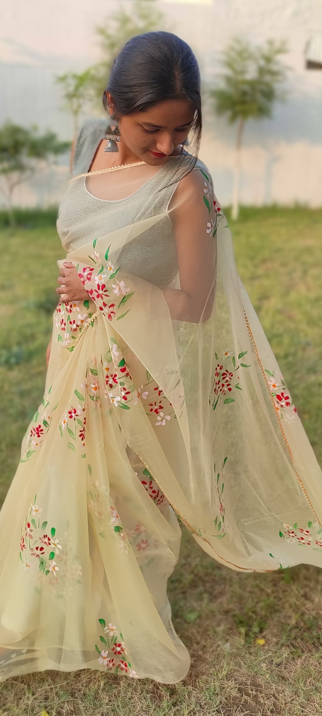 Beige Handpainted organza saree with tassels