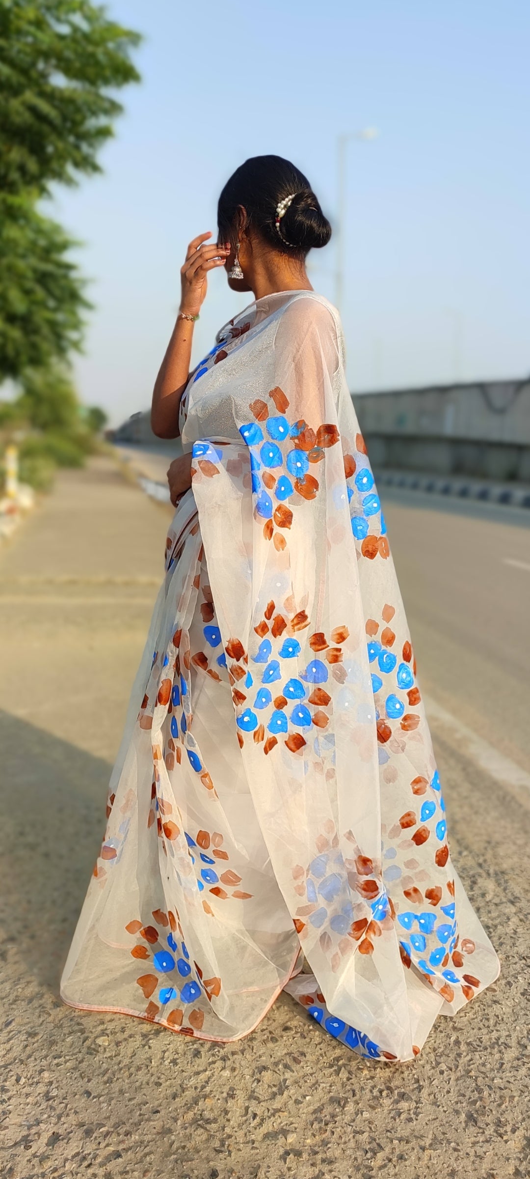 Handpainted white organza saree with tassels