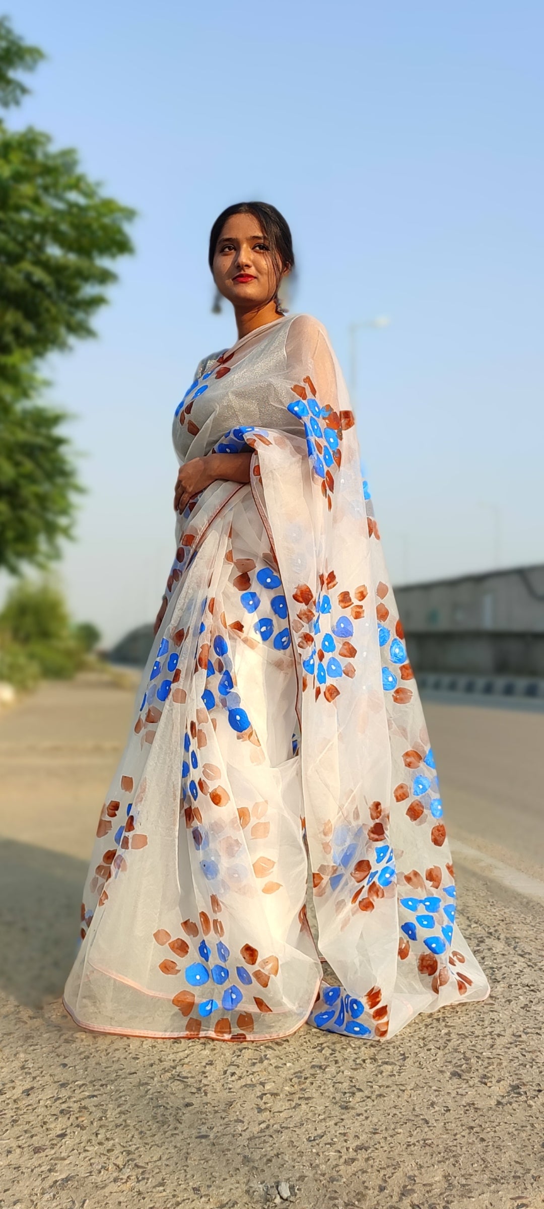 Handpainted white organza saree with tassels