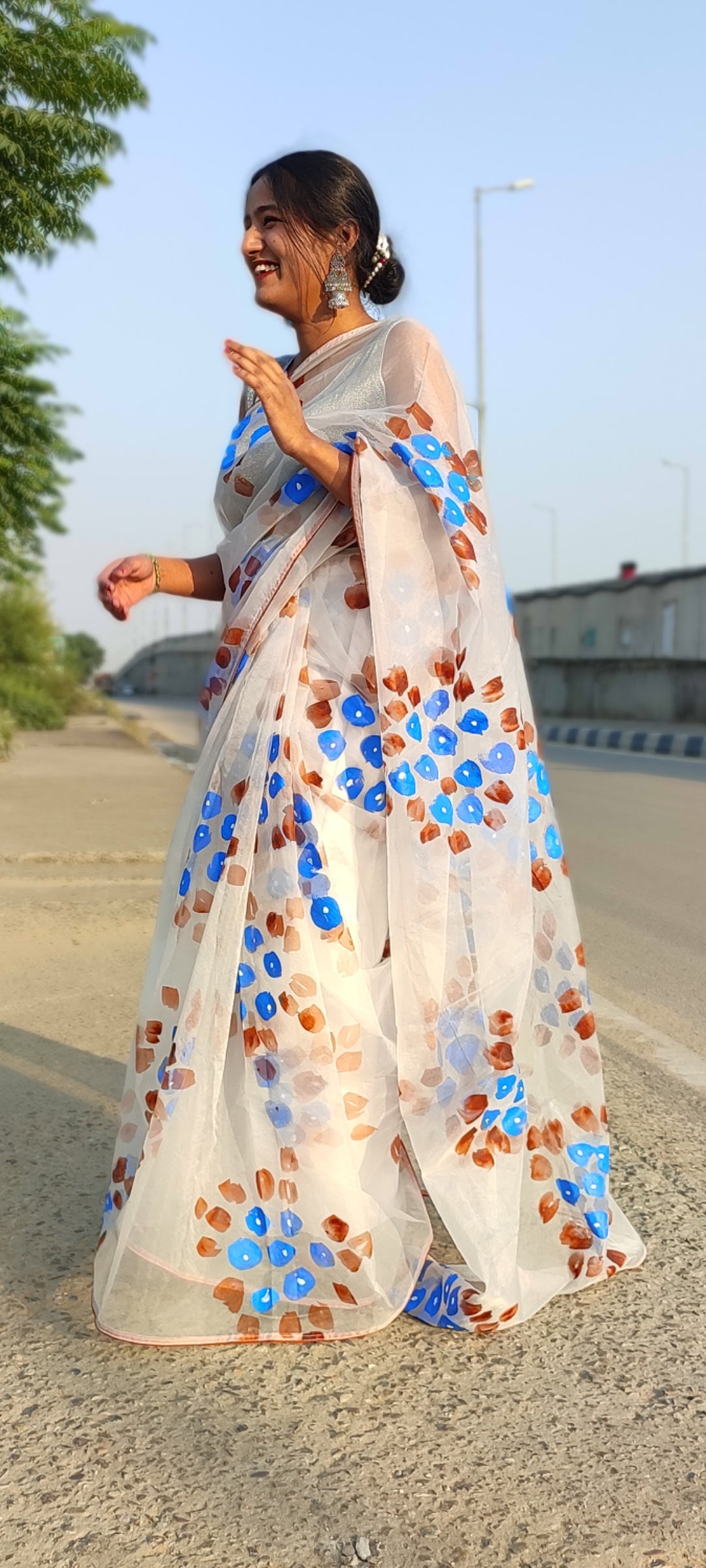 Handpainted white organza saree with tassels
