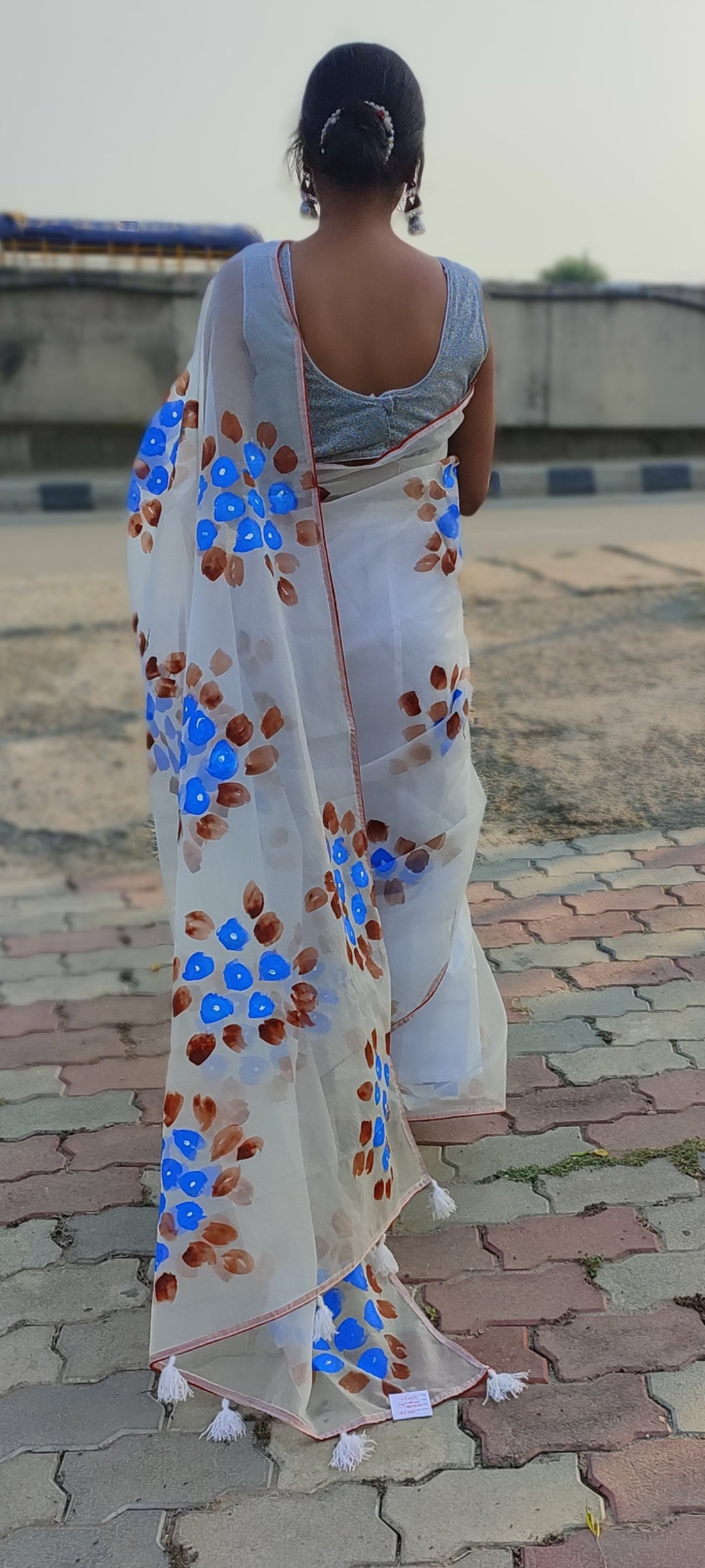 Handpainted white organza saree with tassels