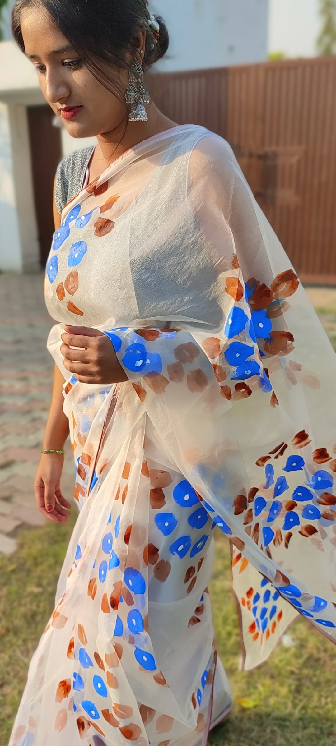 Handpainted white organza saree with tassels