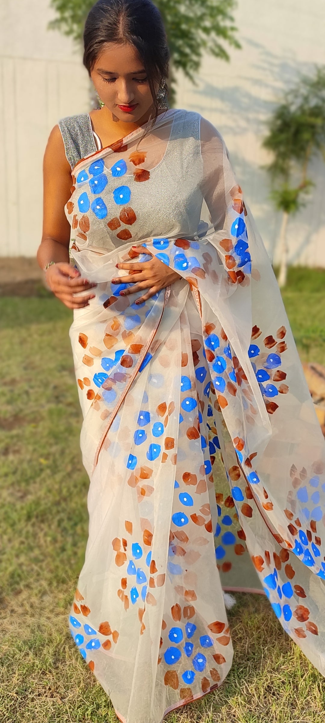 Handpainted white organza saree with tassels