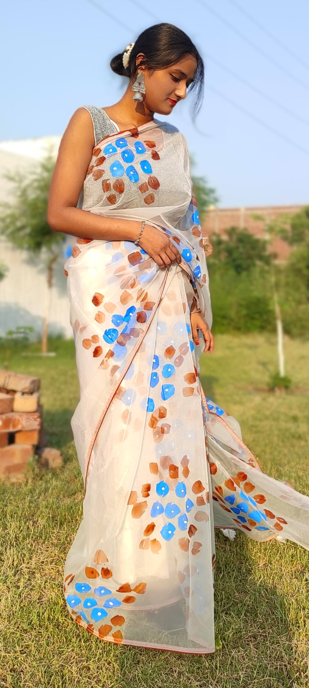 Handpainted white organza saree with tassels