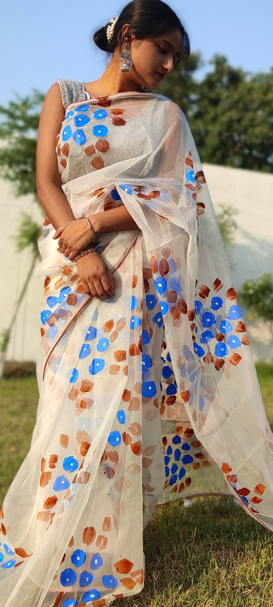 Handpainted white organza saree with tassels