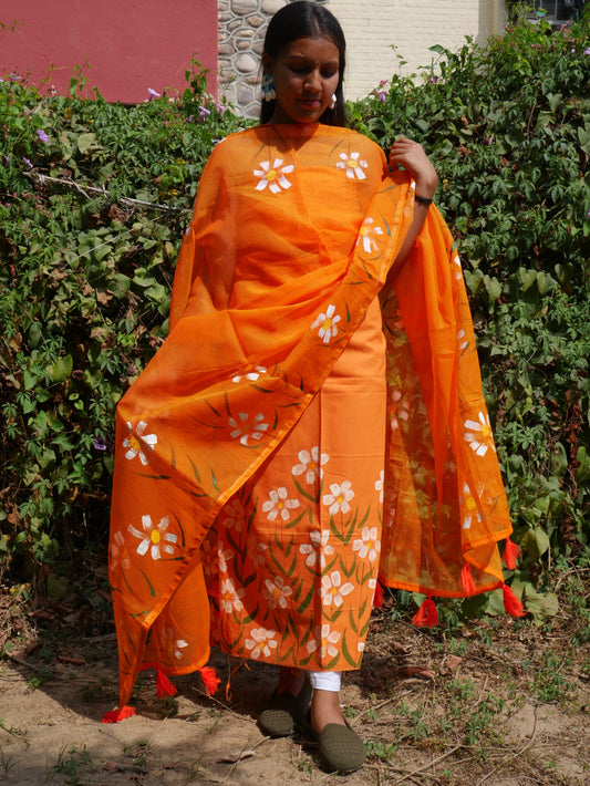 Handpainted orange pure cotton suit with white blossoms and kota doria dupatta