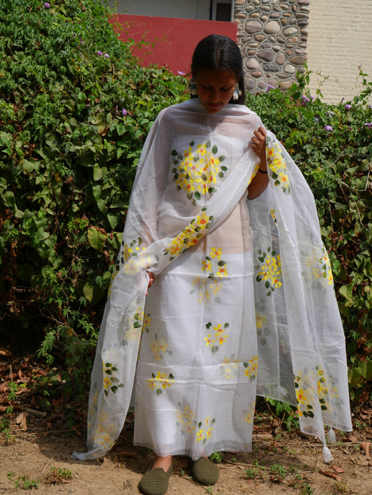 Hand-painted white pure kota doria suit with yellow flowers.